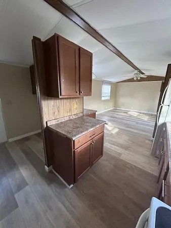 a living room with granite countertop furniture and a fireplace