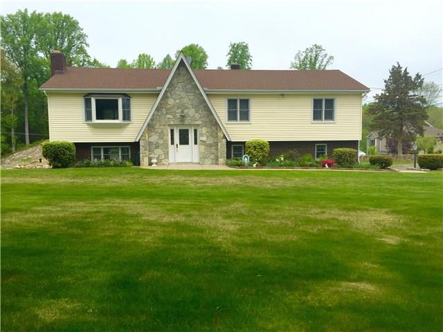 300 Stonehouse Road Trumbull, CT 06611 - Photo 1 of 1 a front view of a house with a garden