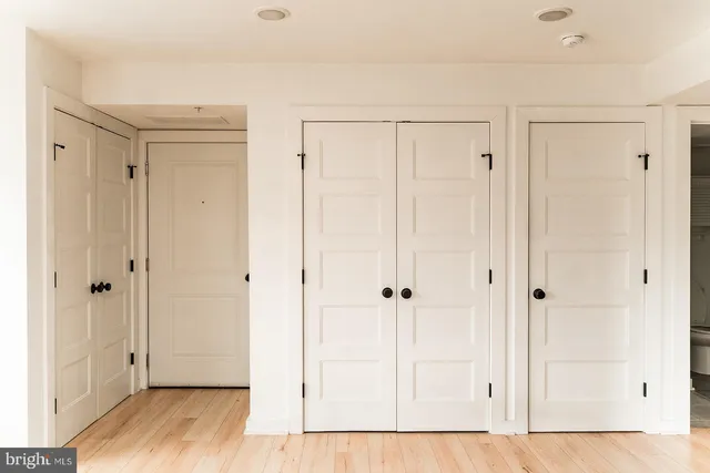 a view of a bathroom with wooden floor