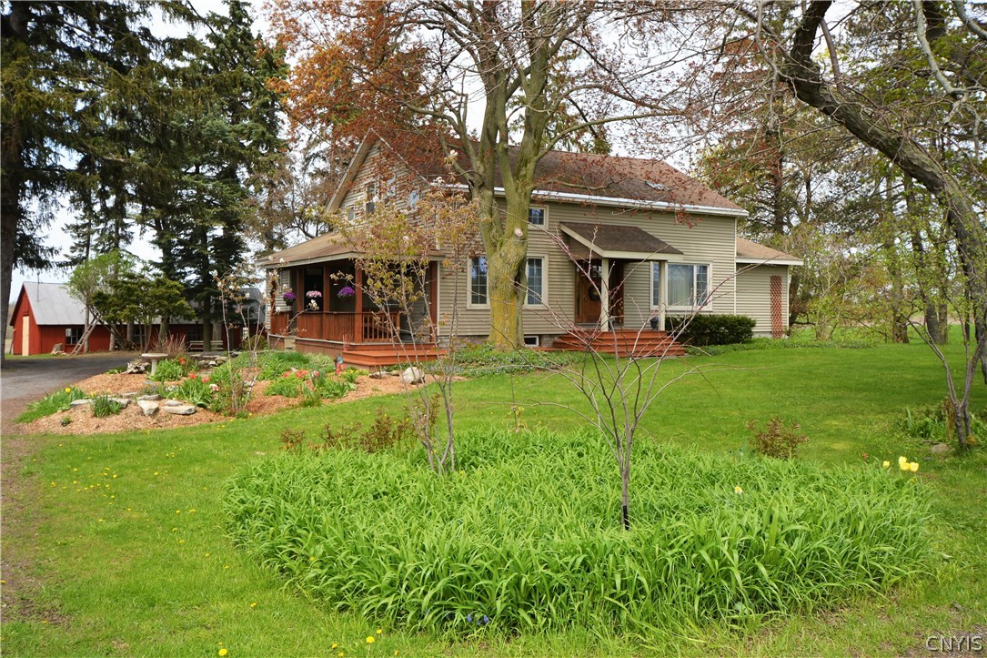 17775 Cady Road Hounsfield, NY 13606 - Photo 1 of 1 Front of home with covered porch. Beautiful landsc
