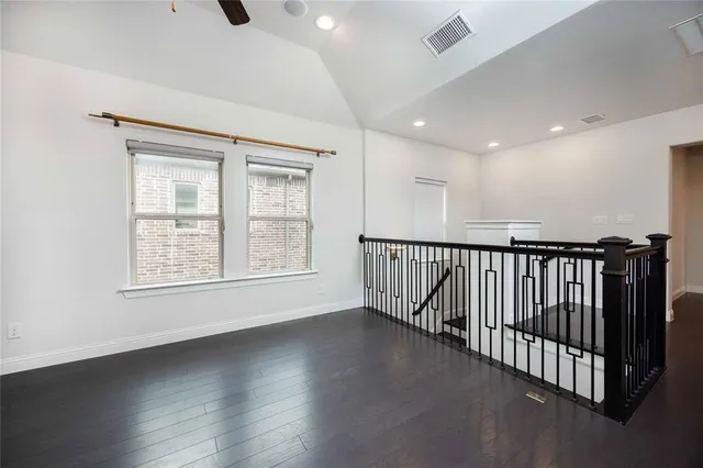 a view of an entryway with wooden floor