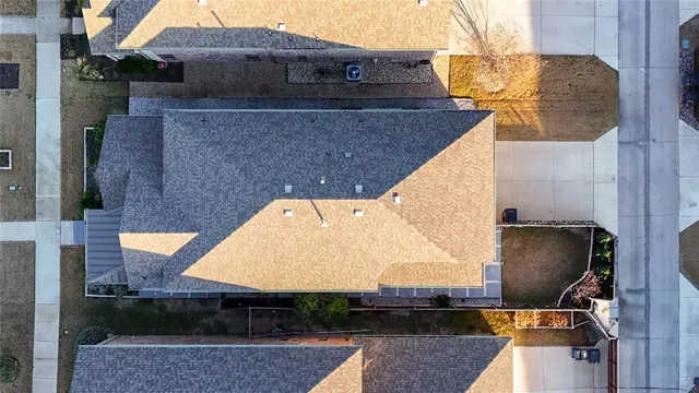 an aerial view of a house with swimming pool