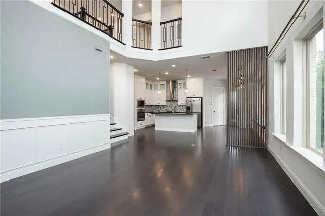 a view of an entryway with wooden floor