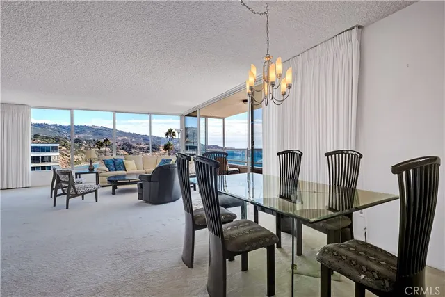 a spacious bedroom with a bed and a large window