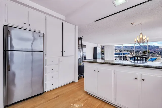 a living room with a floor to ceiling window and a table