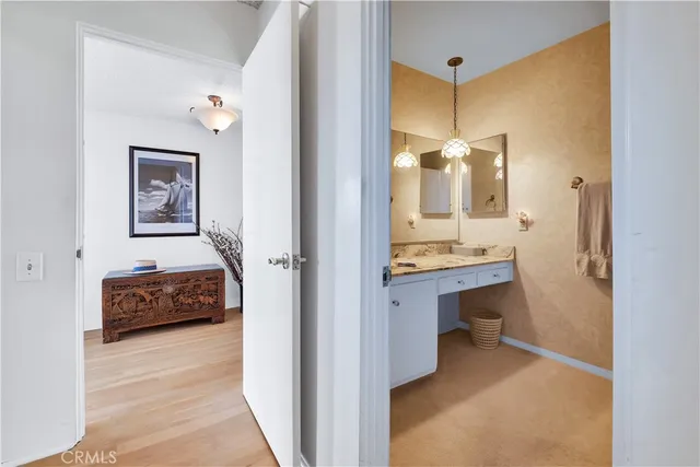 a view of a swimming pool with outdoor seating and plants