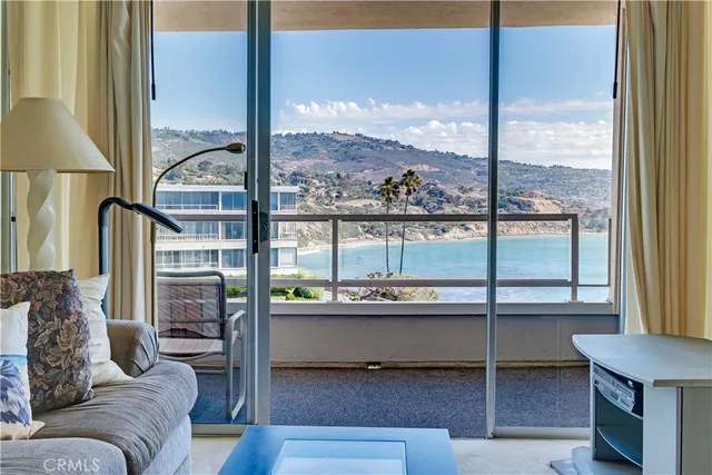 a room with furniture and a large window