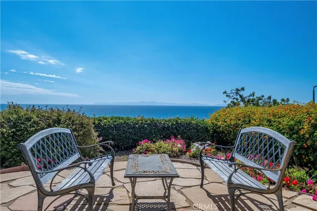 an aerial view of a house with a ocean view