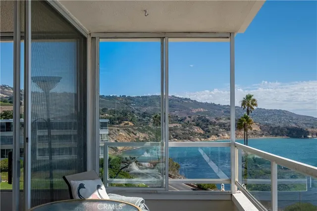 a living room with furniture wooden floor and a table