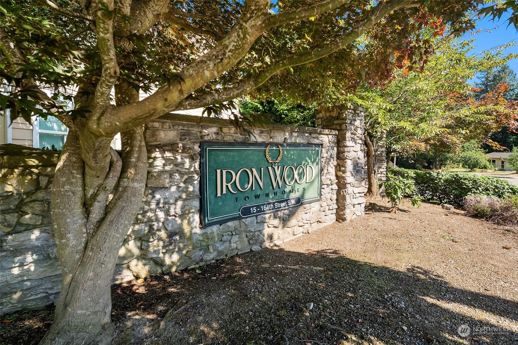15 164th Street Southwest, Unit H4 Bothell, WA 98012 - Photo 18 of 18 a sign board with tree in the background