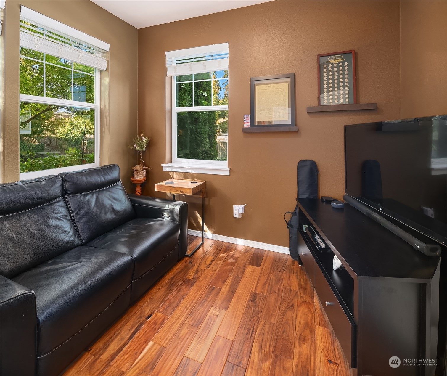 15 164th Street Southwest, Unit H4 Bothell, WA 98012 - Photo 9 of 18 a living room with furniture and a flat screen tv