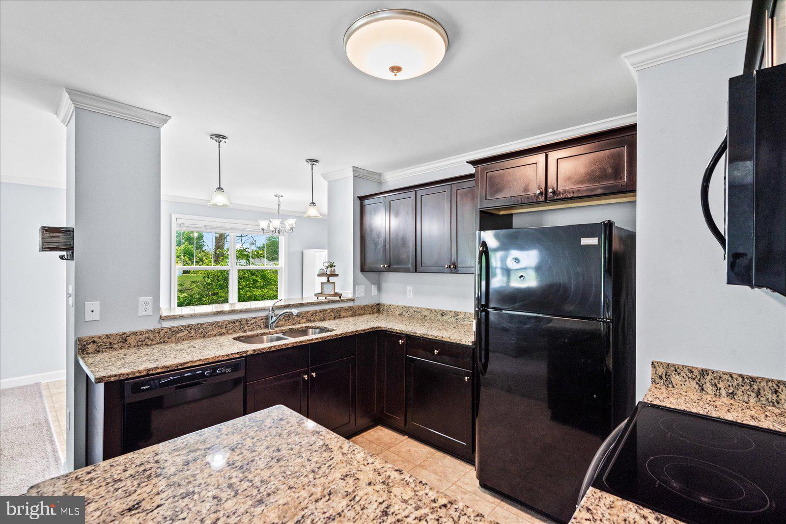 129 Brooks Drive Colonial Beach, VA 22443 - Photo 12 of 40 a kitchen with stainless steel appliances granite countertop a refrigerator and a sink