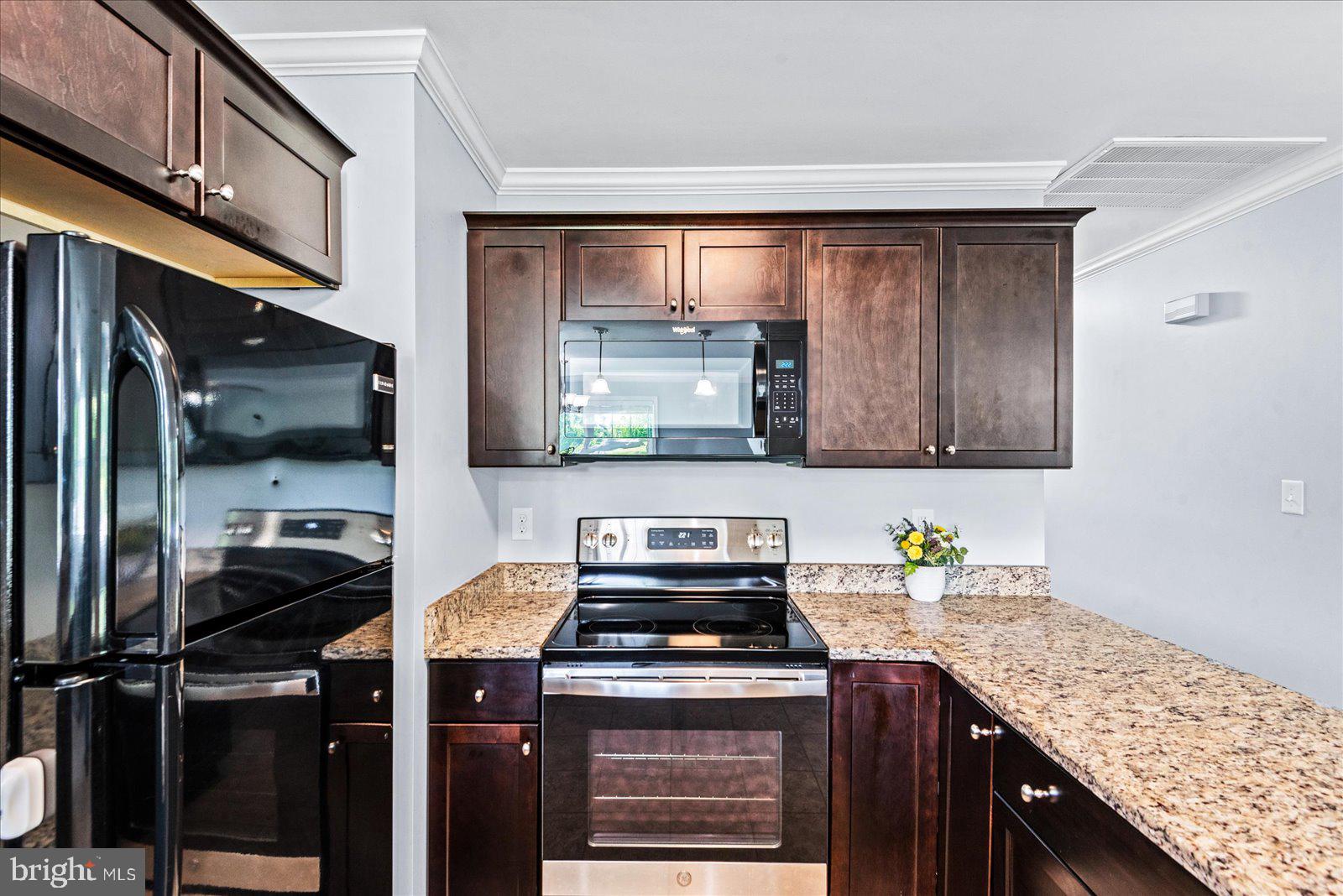 129 Brooks Drive Colonial Beach, VA 22443 - Photo 13 of 40 a kitchen with a stove and a sink