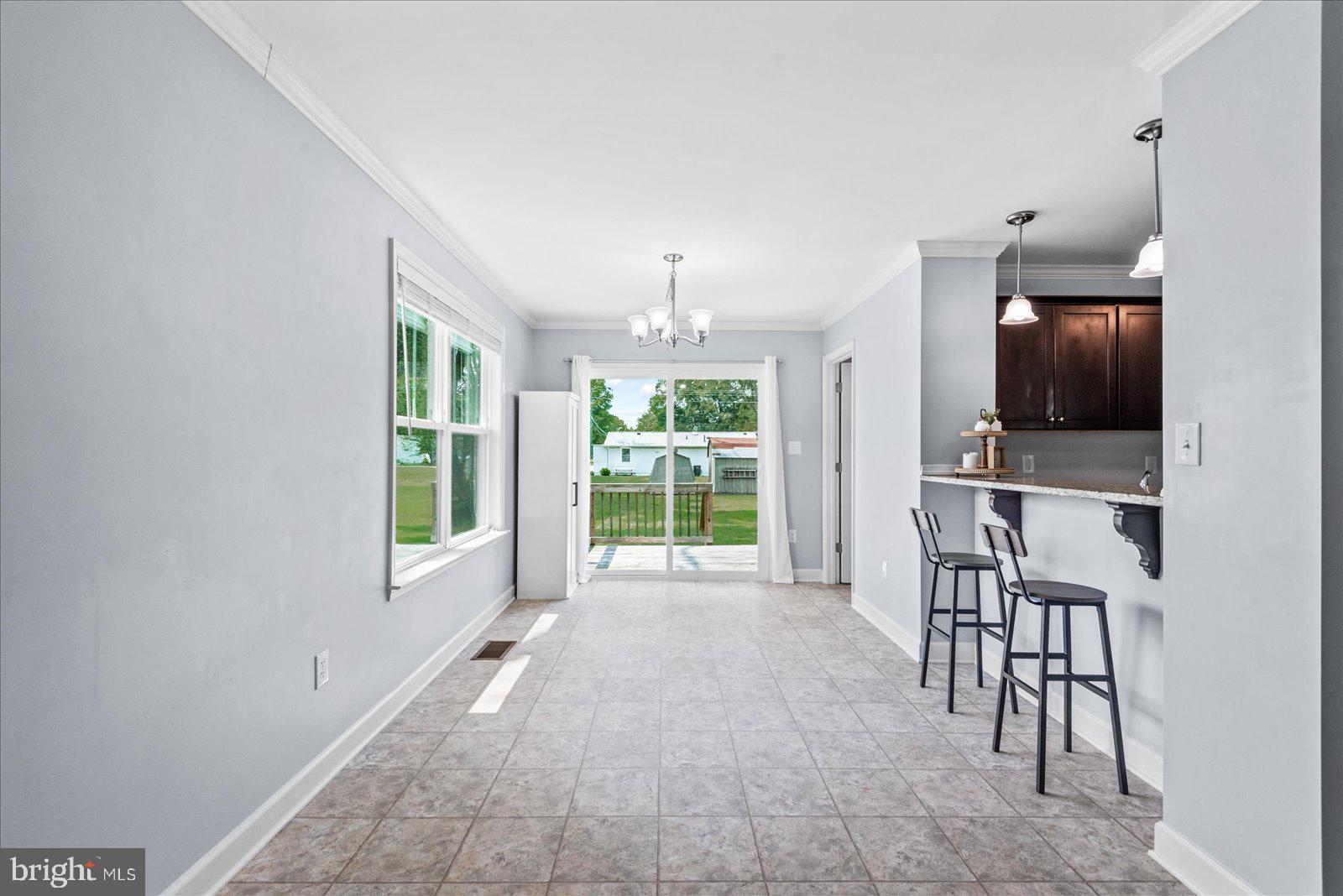 129 Brooks Drive Colonial Beach, VA 22443 - Photo 16 of 40 a view of a livingroom with furniture window and outside view