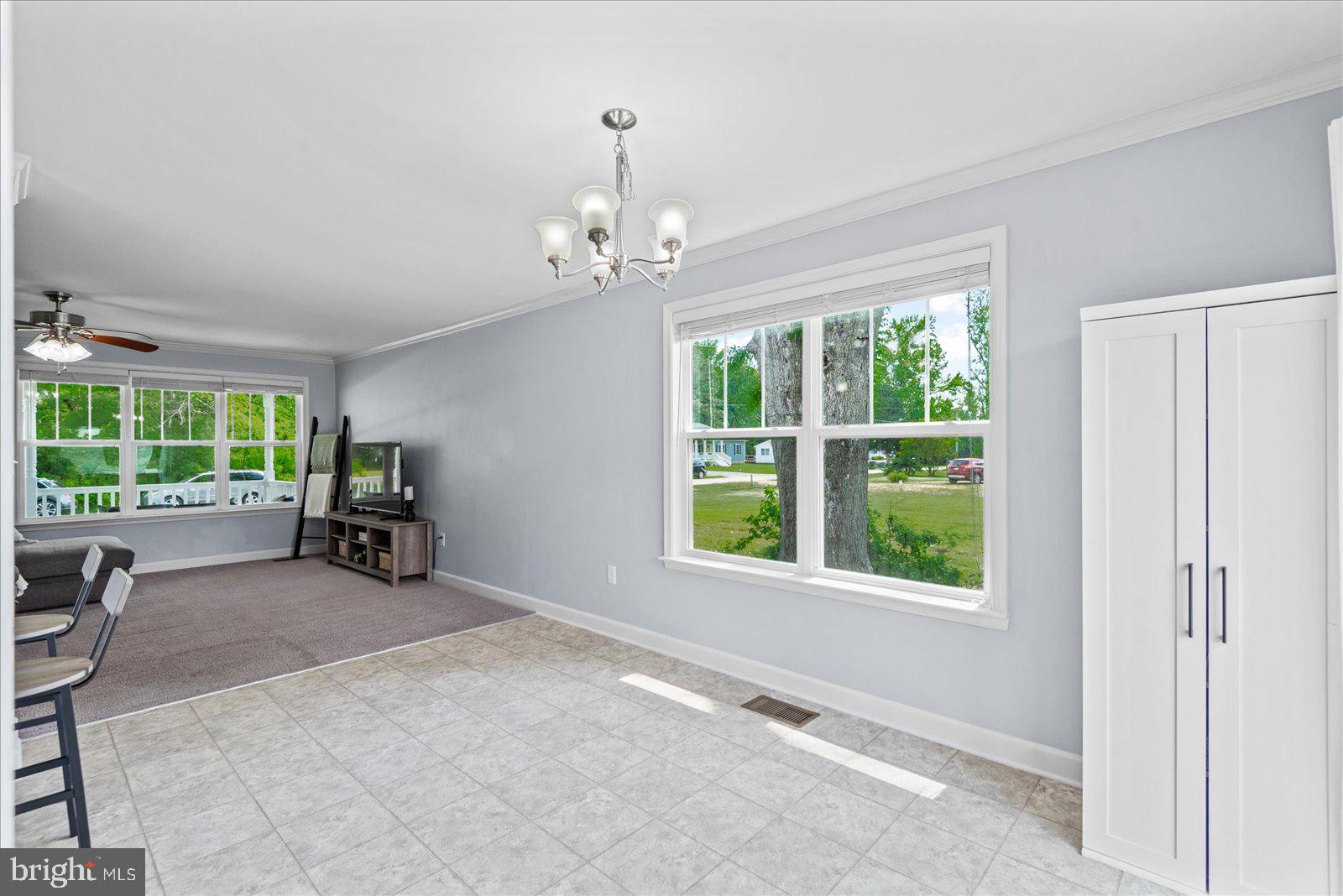 129 Brooks Drive Colonial Beach, VA 22443 - Photo 17 of 40 a view of a livingroom with furniture hardwood and a ceiling fan