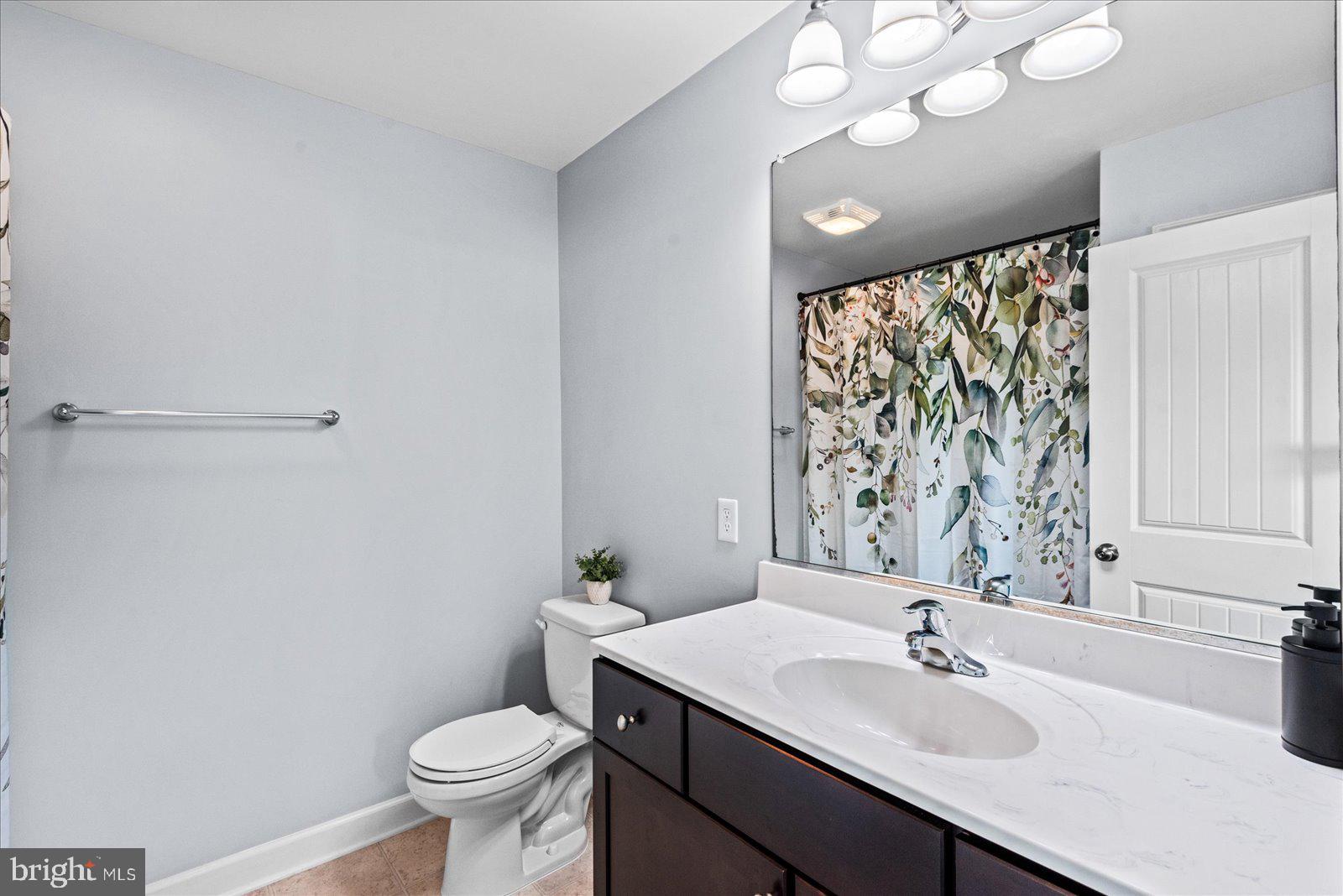 129 Brooks Drive Colonial Beach, VA 22443 - Photo 21 of 40 a bathroom with a sink vanity mirror and toilet