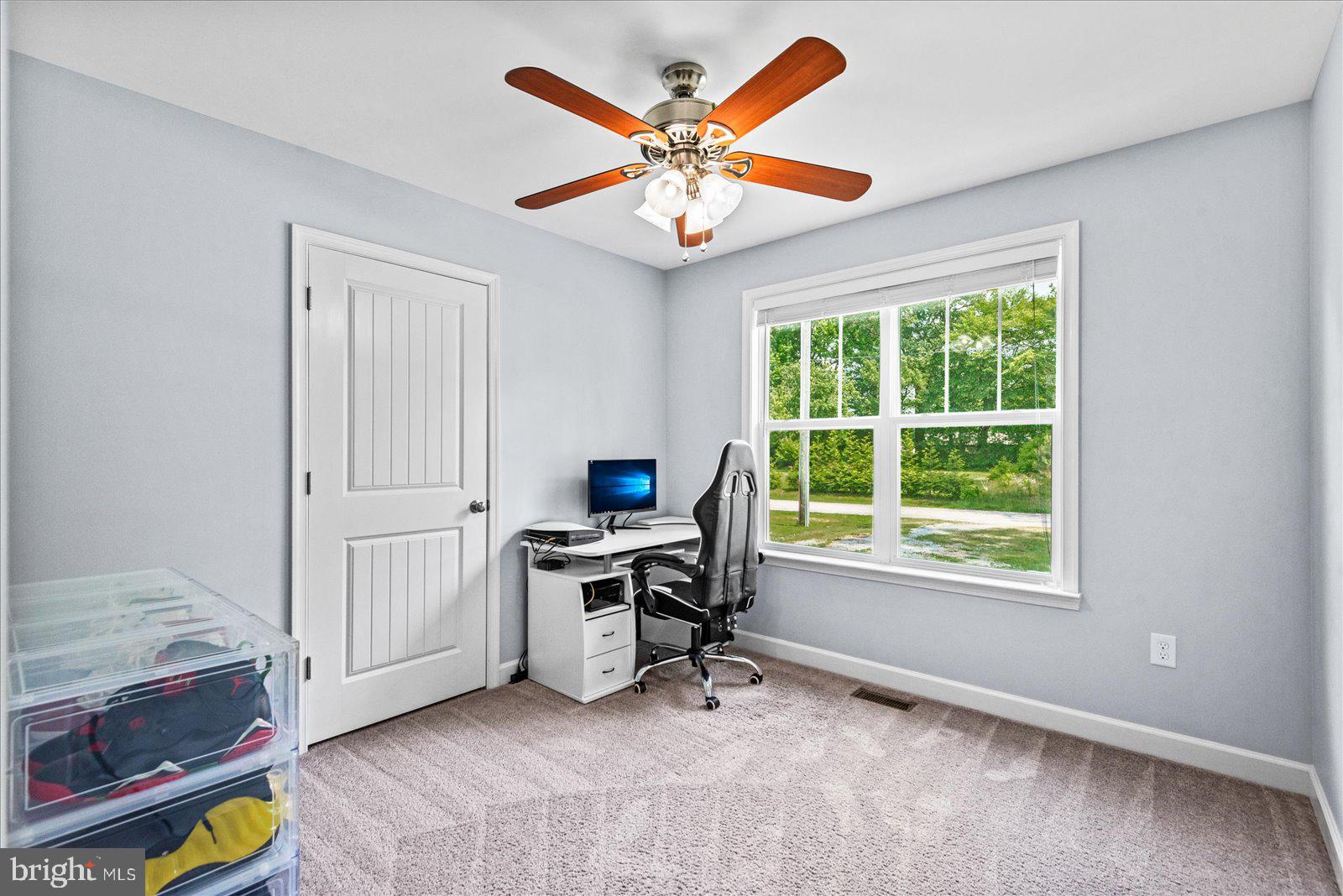 129 Brooks Drive Colonial Beach, VA 22443 - Photo 23 of 40 a view of a workspace with furniture and a window