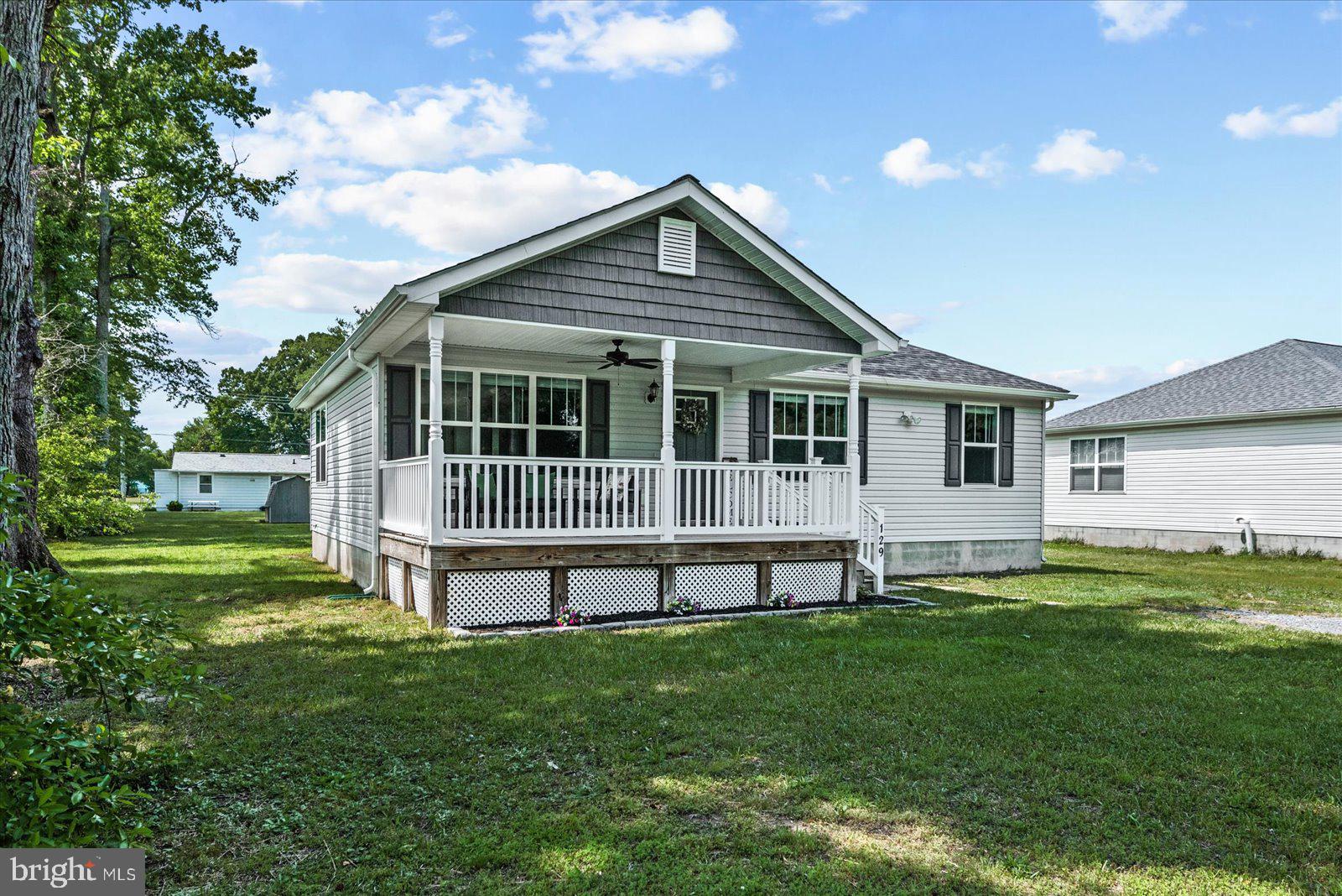 129 Brooks Drive Colonial Beach, VA 22443 - Photo 4 of 40 a view of a house with a yard and deck