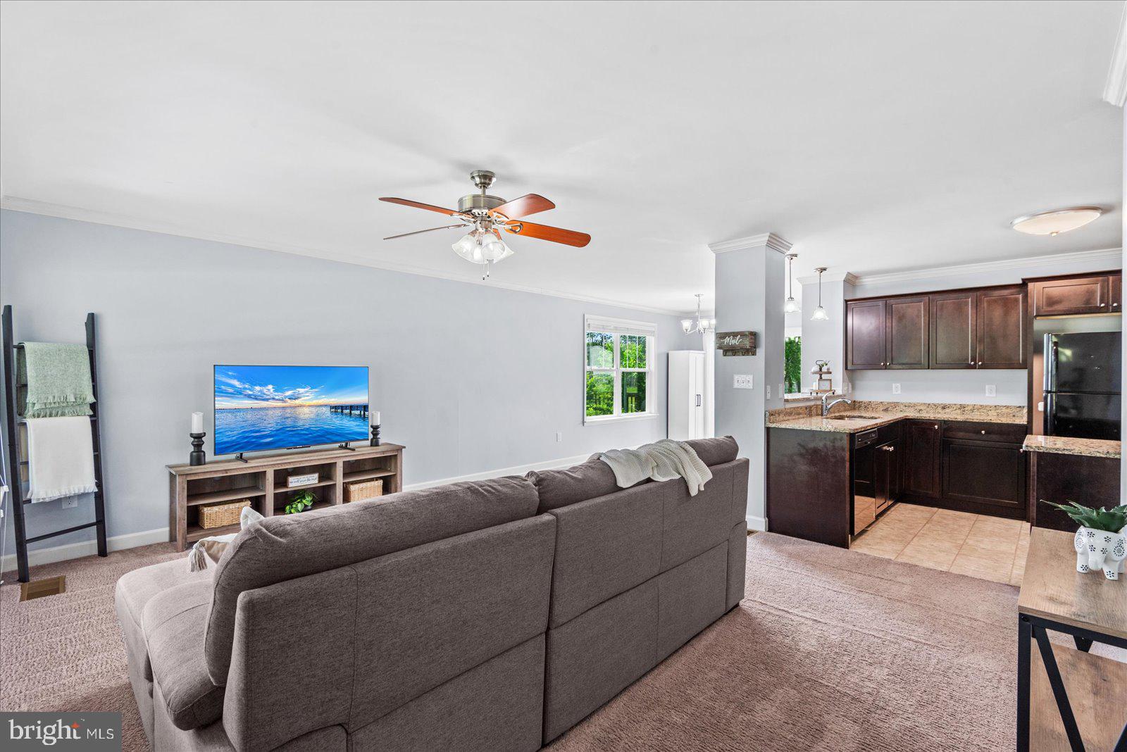 129 Brooks Drive Colonial Beach, VA 22443 - Photo 6 of 40 a living room with furniture and kitchen view
