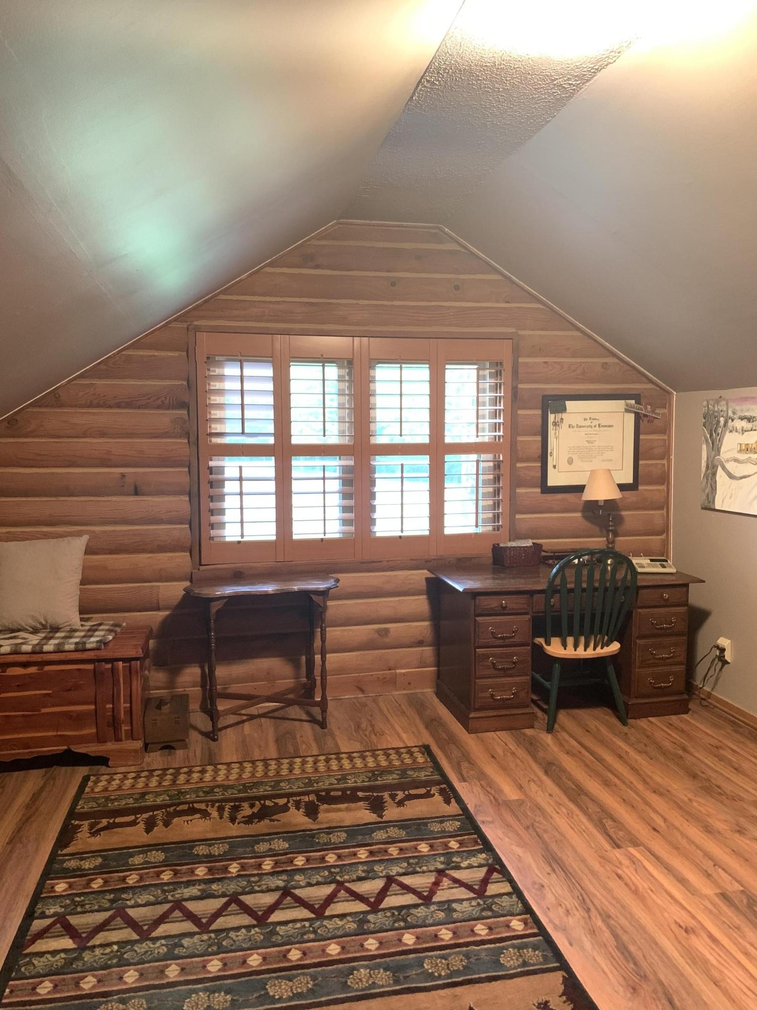 10017 Rutledge Pike Corryton, TN 37721 - Photo 17 of 38 a bedroom with furniture and wooden floor
