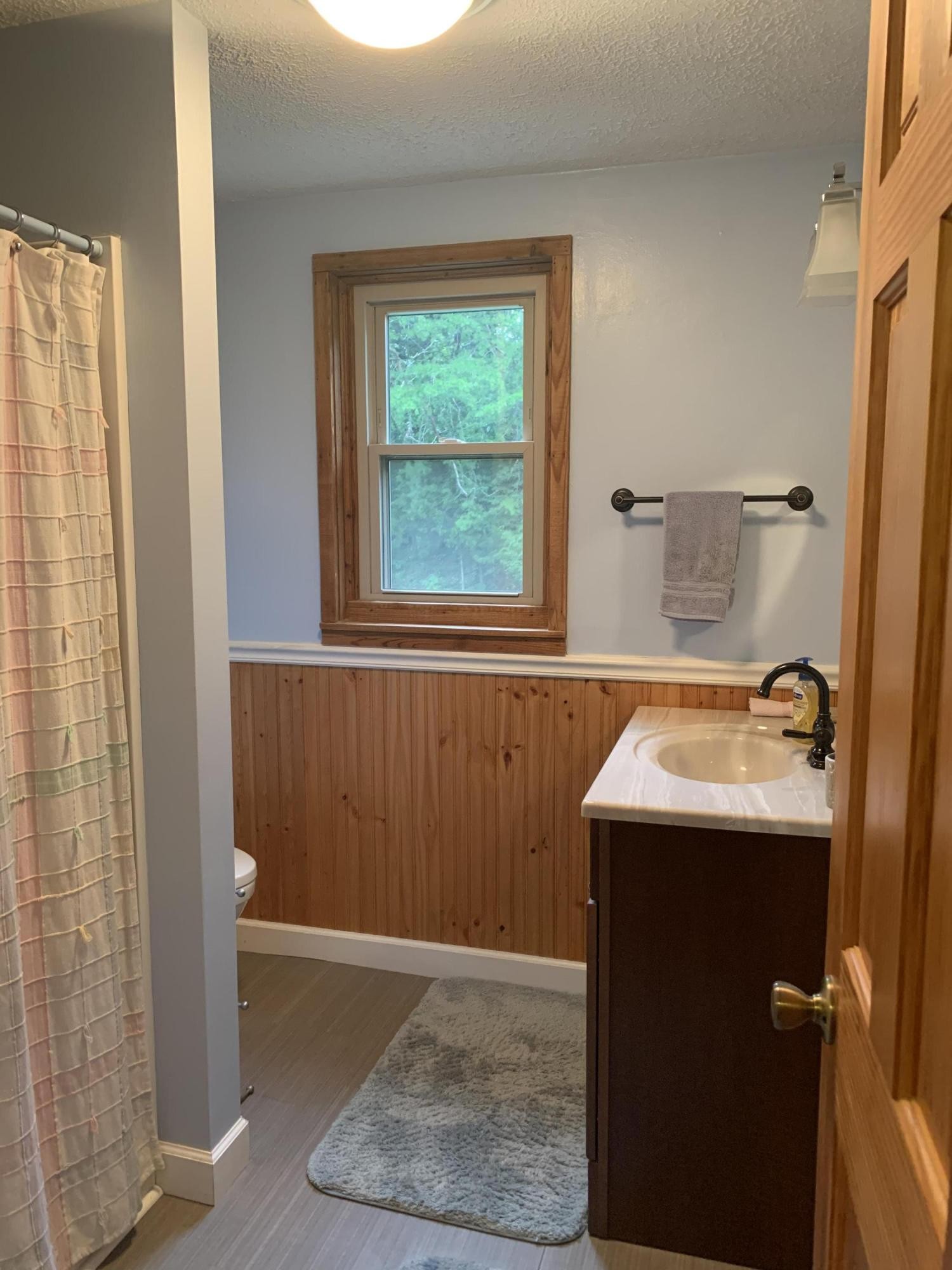 10017 Rutledge Pike Corryton, TN 37721 - Photo 18 of 38 a bathroom with a sink a toilet and shower