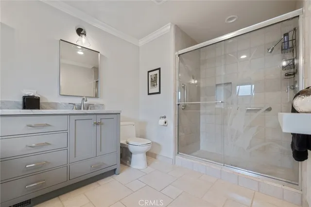 a bathroom with a toilet sink a shower and