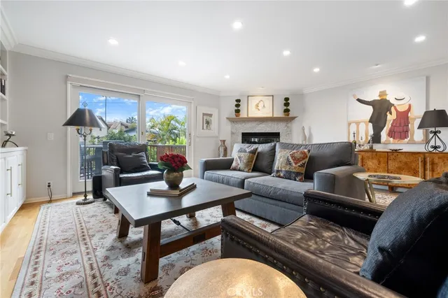 a living room with furniture a window and a table