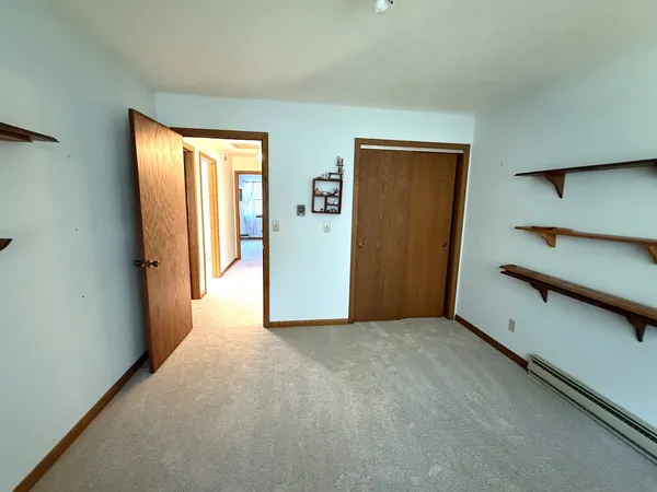 a view of empty room with closet