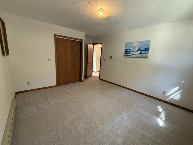 a view of an empty room and a window