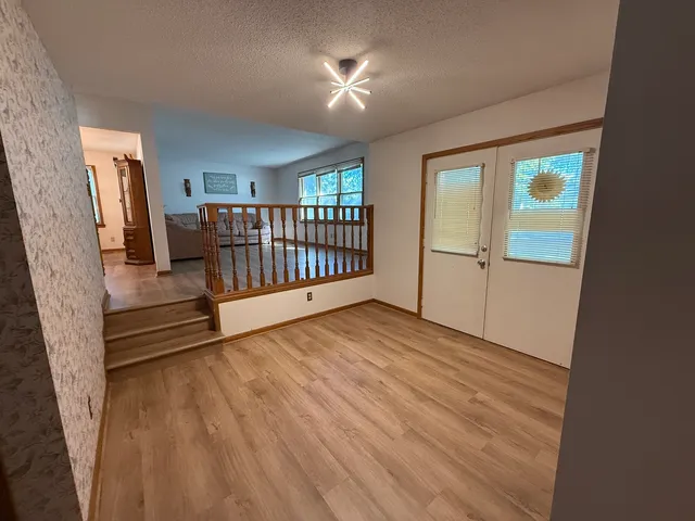 a view of livingroom with furniture and hardwood floor