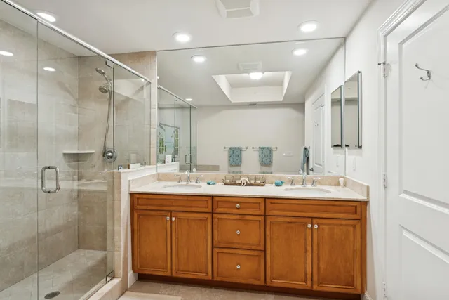 a bathroom with a double vanity sink mirror and double
