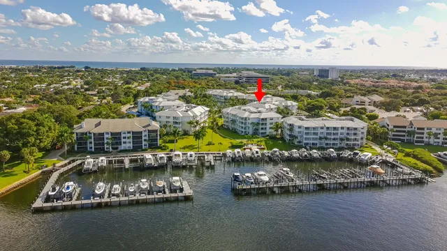 an aerial view of a house with a lake view