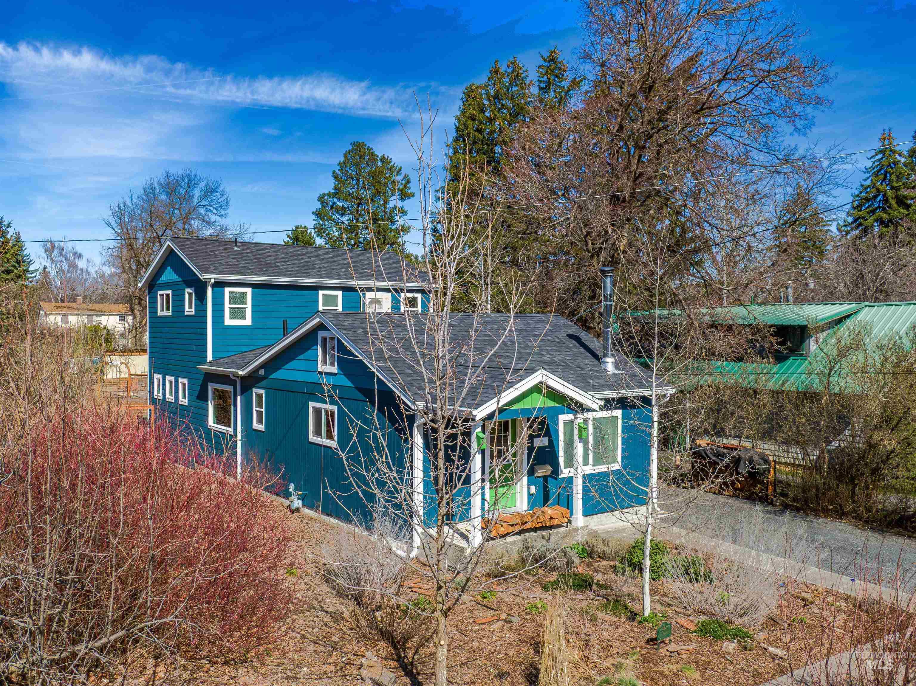 View of front of house featuring a shingled roof