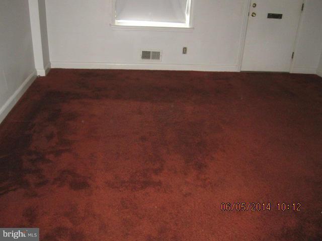 2137 Redthorn Road Baltimore, MD 21220 - Photo 5 of 9 a view of wooden floor and windows in a room