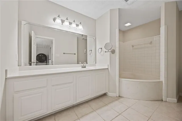 a bathroom with a double vanity sink and a mirror