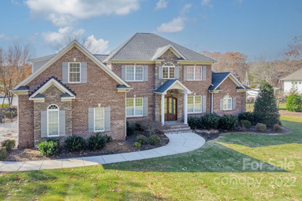 144 Greyfriars Road Mooresville, NC 28117 - Photo 1 of 43 a front view of a house with a yard and garage