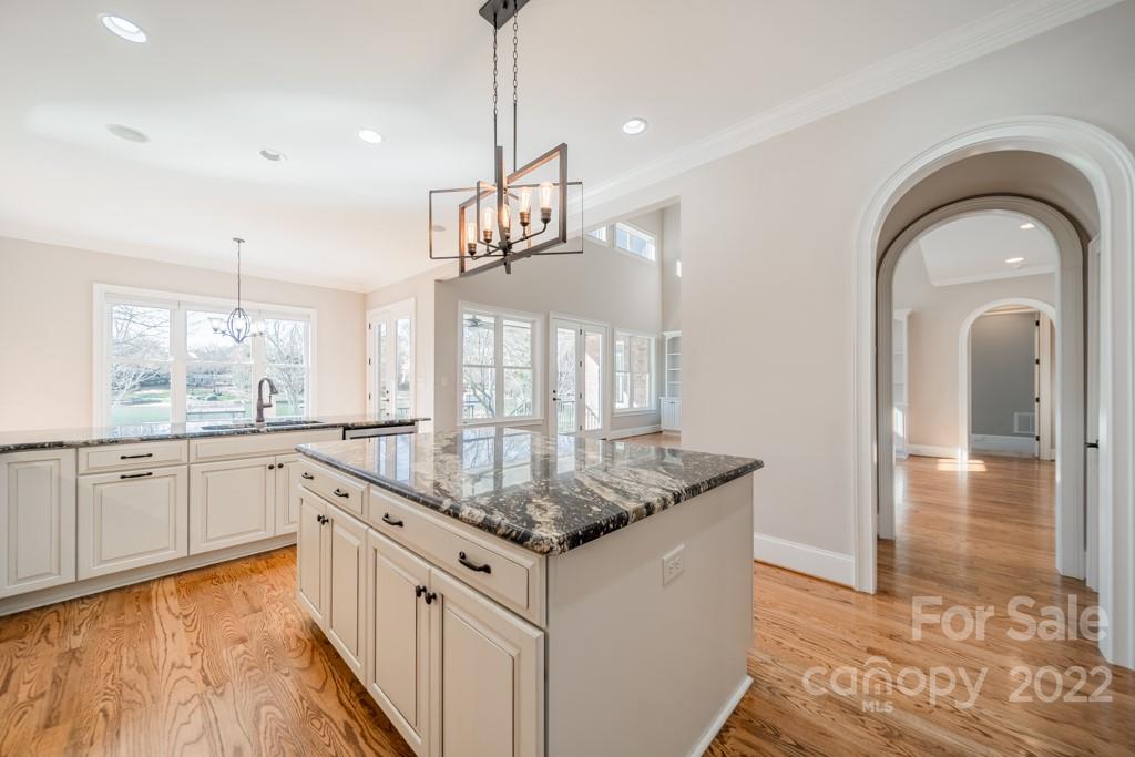 144 Greyfriars Road Mooresville, NC 28117 - Photo 16 of 43 a kitchen with granite countertop a sink a counter space appliances and cabinets