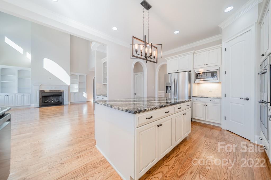 144 Greyfriars Road Mooresville, NC 28117 - Photo 17 of 43 a large kitchen with granite countertop a large counter top appliances and cabinets