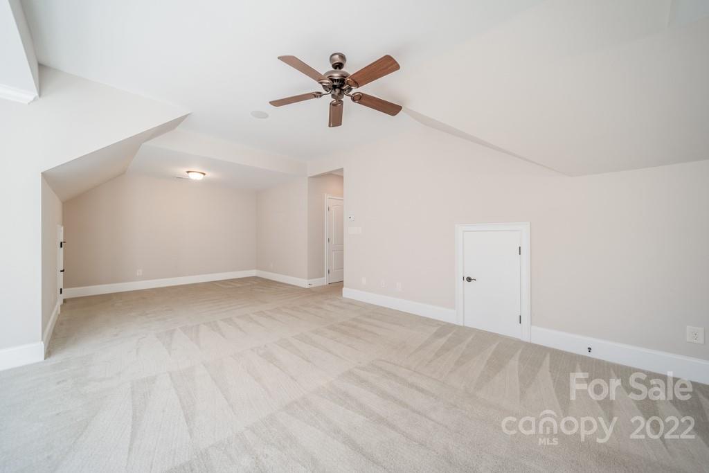 144 Greyfriars Road Mooresville, NC 28117 - Photo 32 of 43 a view of a ceiling fan with wooden floor in a room