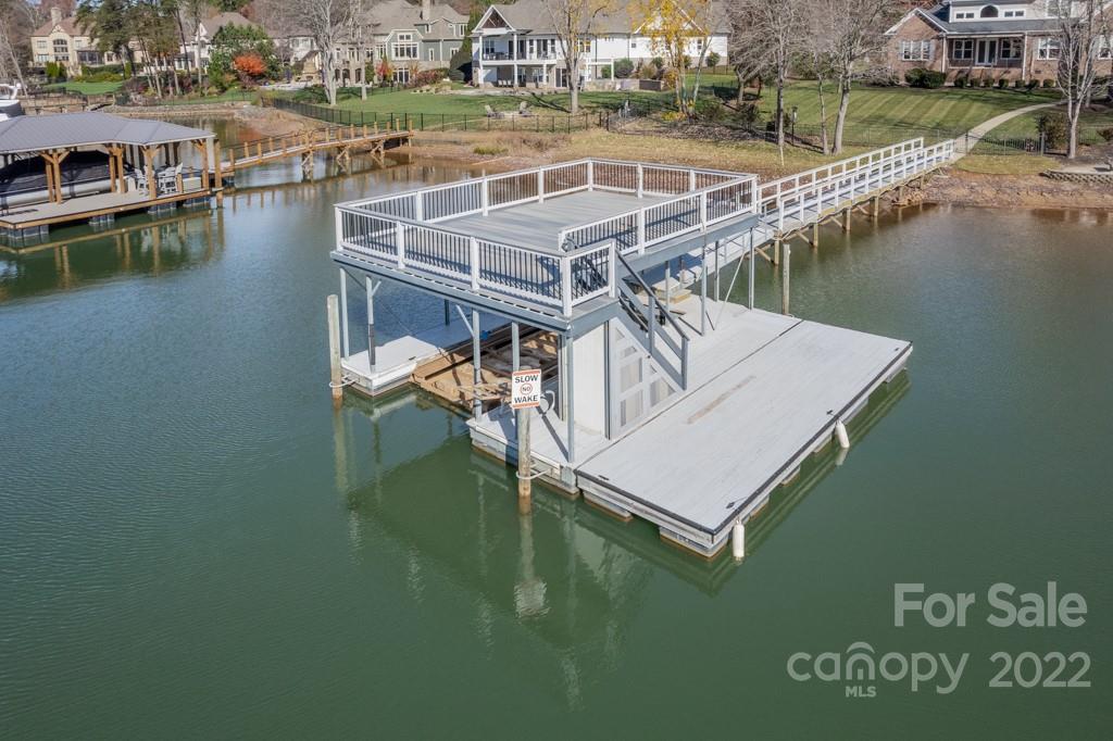 144 Greyfriars Road Mooresville, NC 28117 - Photo 38 of 43 a view of a lake with houses