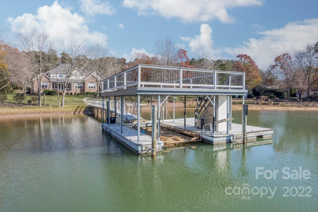 144 Greyfriars Road Mooresville, NC 28117 - Photo 39 of 43 a view of a lake with a house