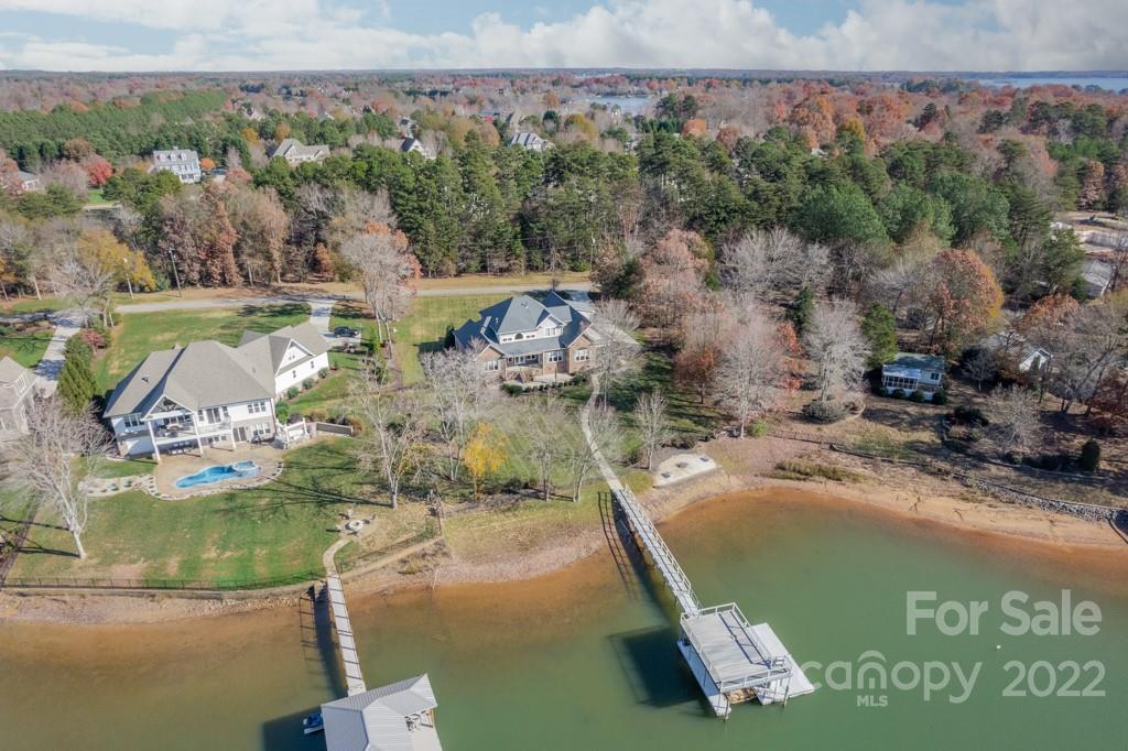 144 Greyfriars Road Mooresville, NC 28117 - Photo 42 of 43 a view of a lake with a building in the background