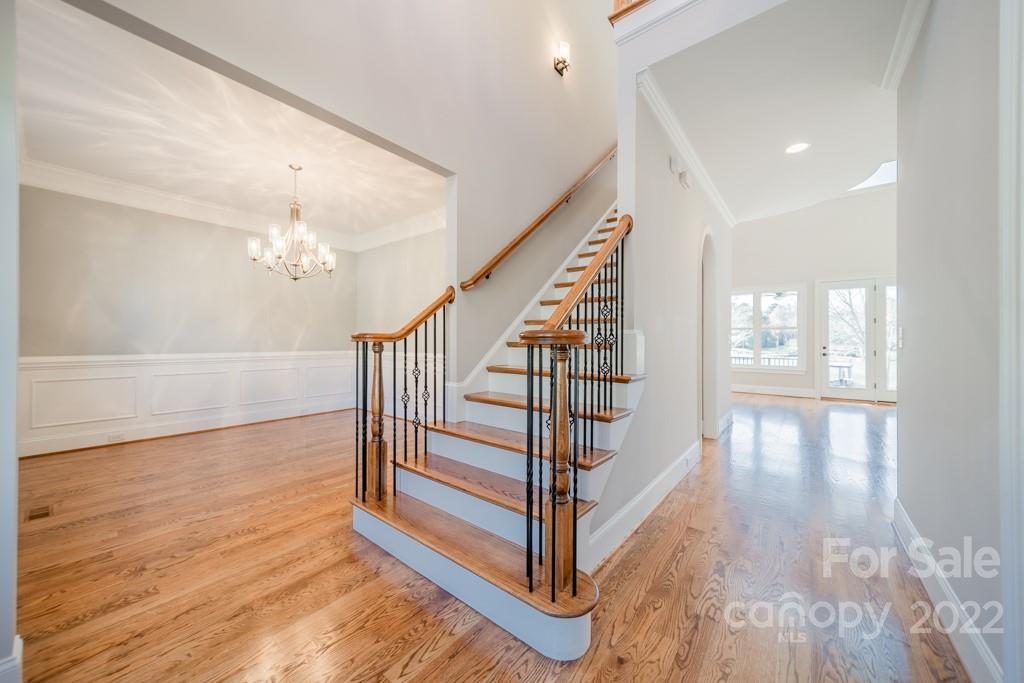 144 Greyfriars Road Mooresville, NC 28117 - Photo 10 of 43 a view of entryway and hall with wooden floor