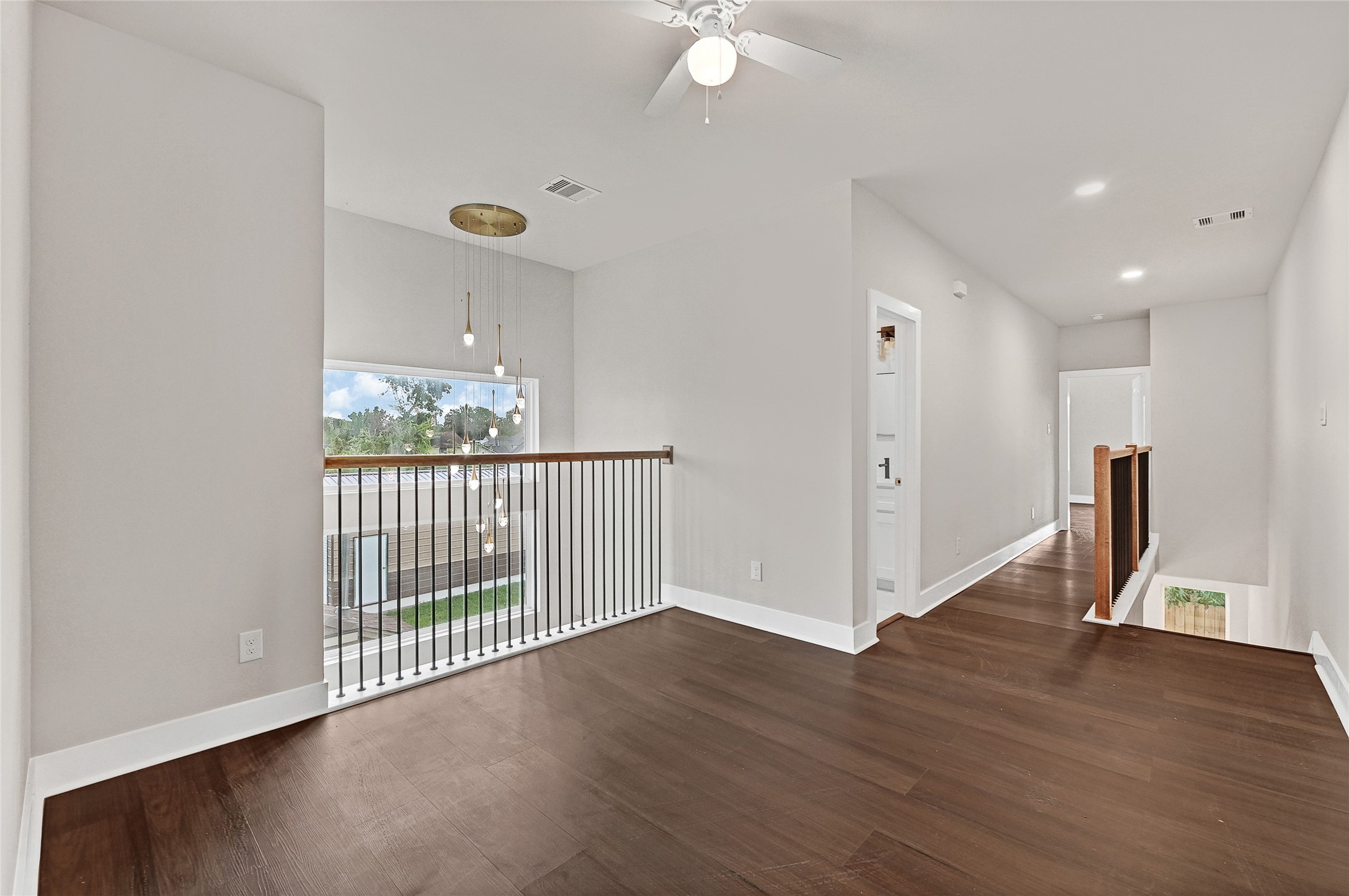 7938 Angus Street Houston, TX 77028 - Photo 12 of 25 a view of a hallway with wooden floor