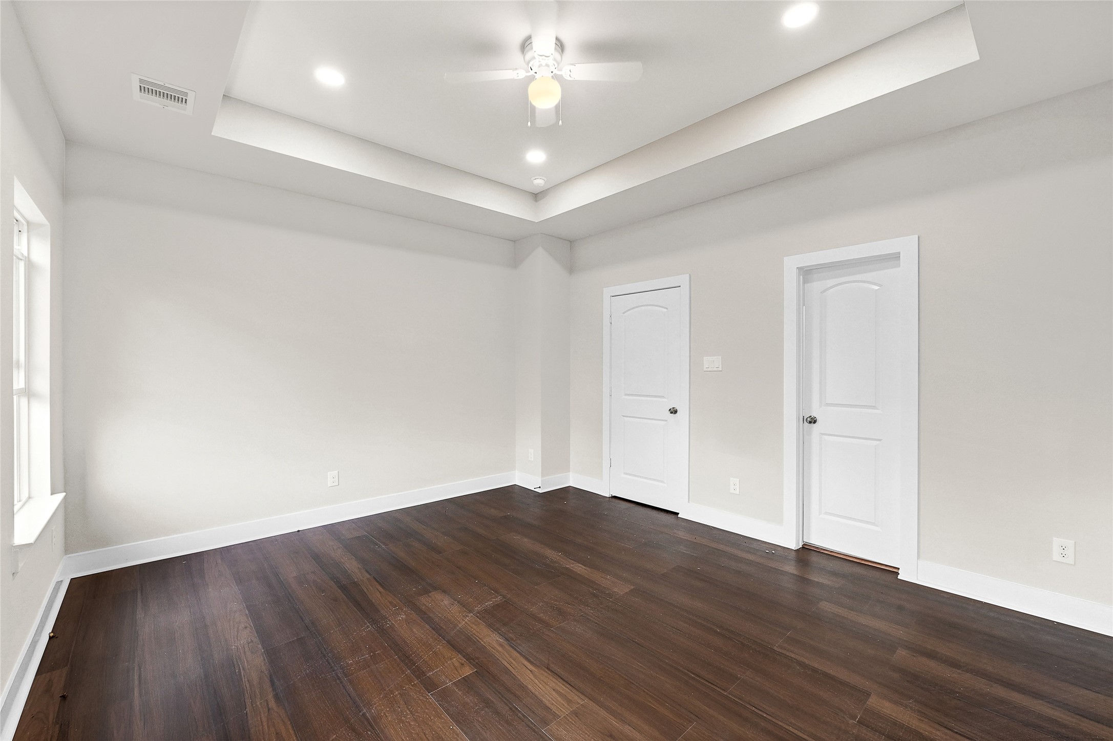 7938 Angus Street Houston, TX 77028 - Photo 20 of 25 wooden floor in an empty room with a window