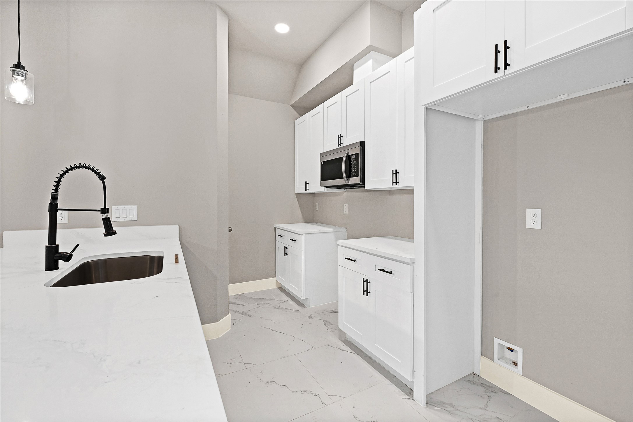 7938 Angus Street Houston, TX 77028 - Photo 6 of 25 a kitchen with stainless steel appliances a sink a stove and a refrigerator