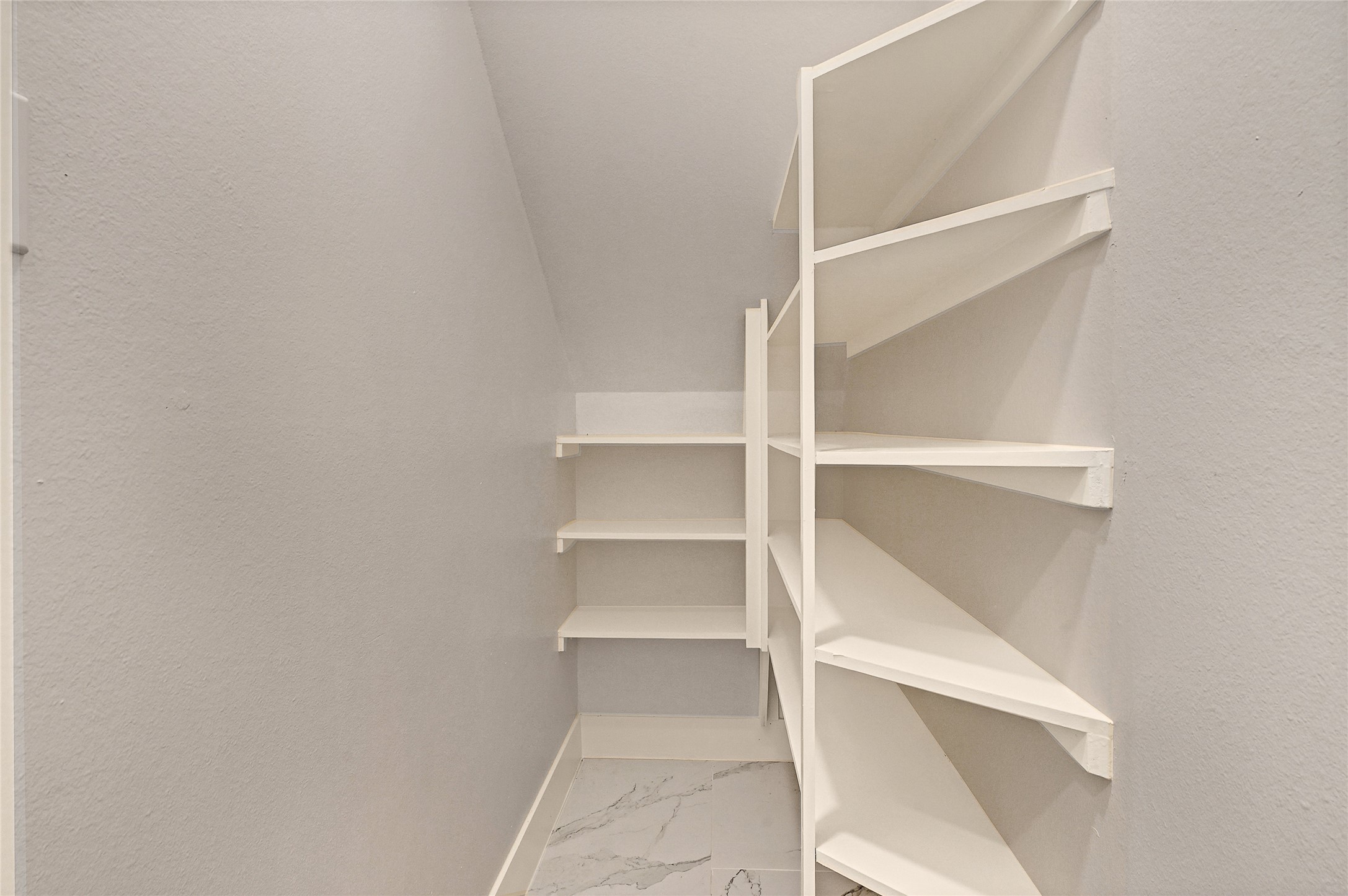 7938 Angus Street Houston, TX 77028 - Photo 8 of 25 a view of walk in closet with empty racks