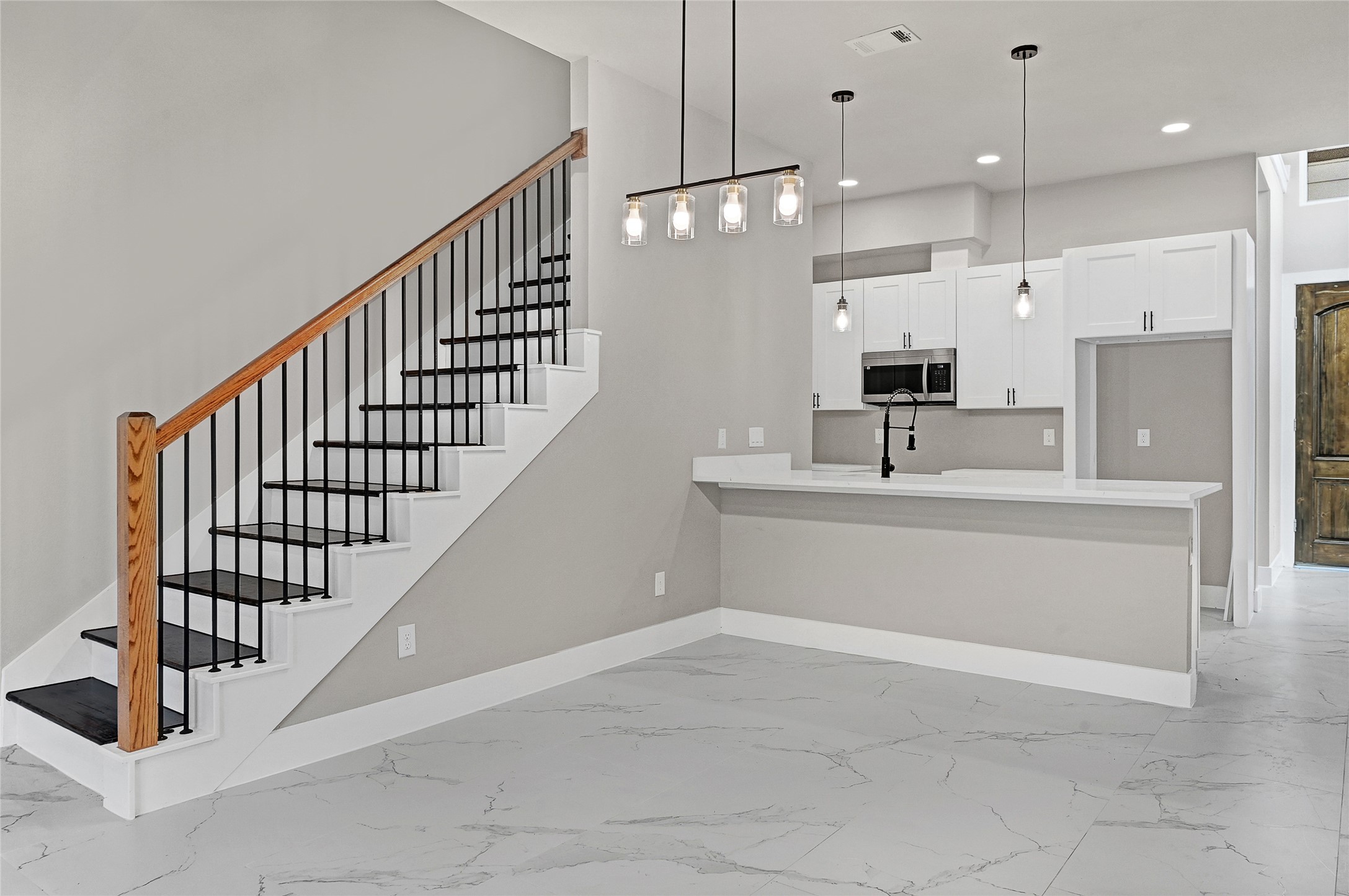 7938 Angus Street Houston, TX 77028 - Photo 9 of 25 a view of kitchen with kitchen island stainless steel appliances sink stove and cabinets
