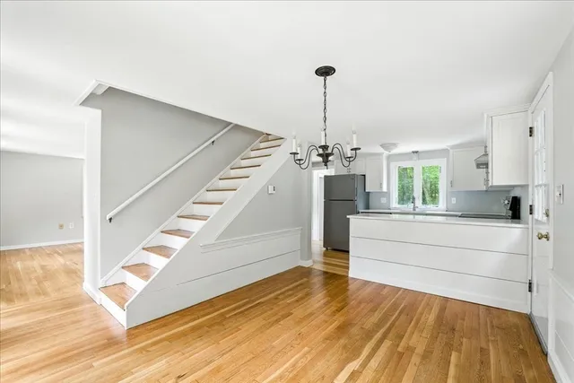 a bathroom with a sink toilet and a mirror