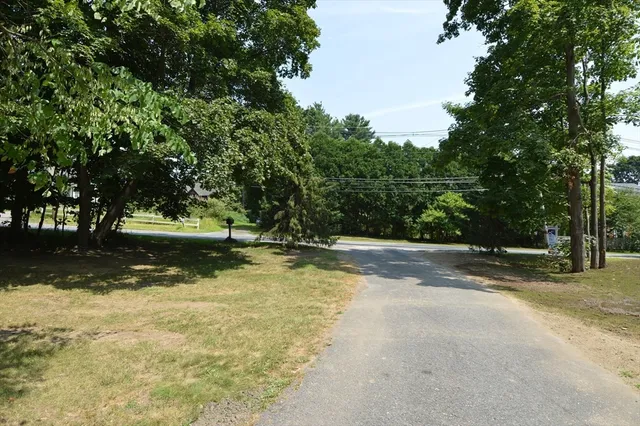 a view of a wooden deck with a yard